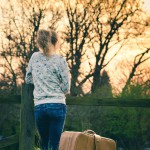 Young woman with suitcase