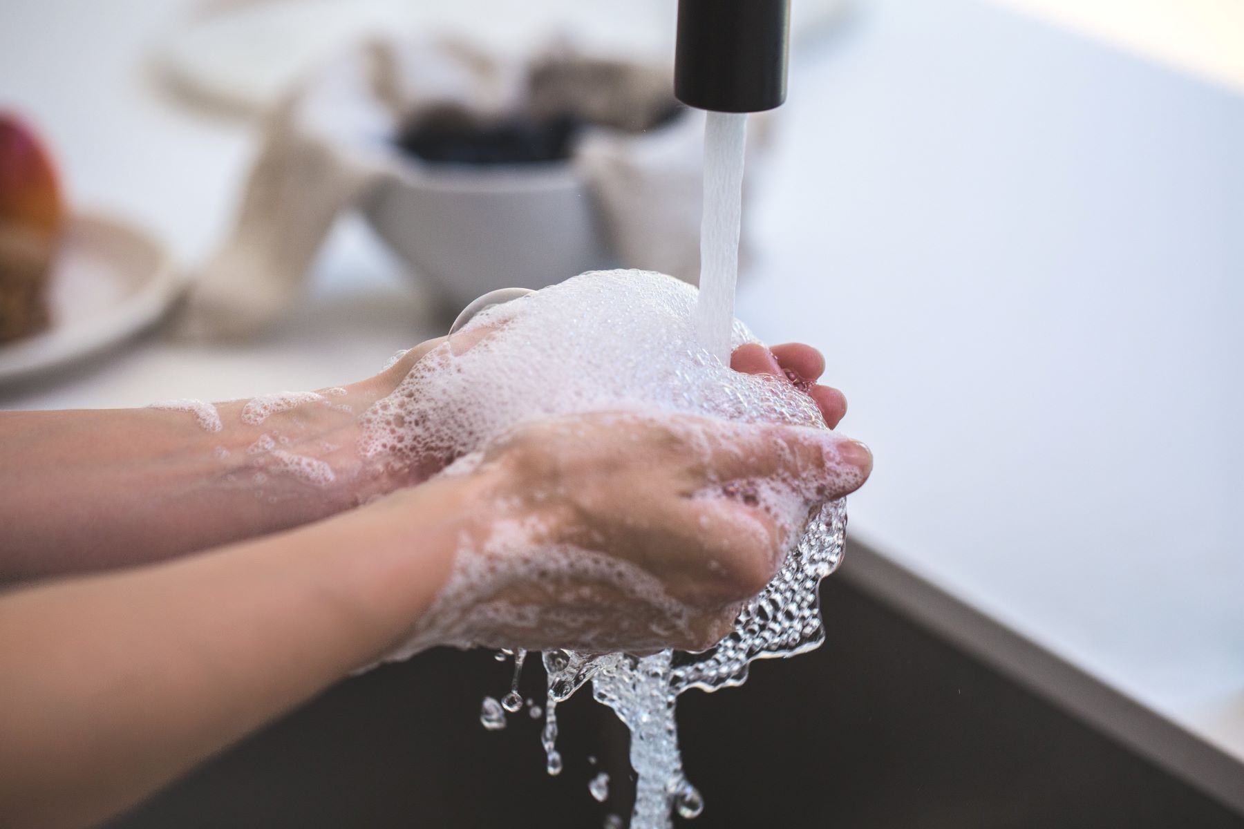 Canva - Person Washing Hands