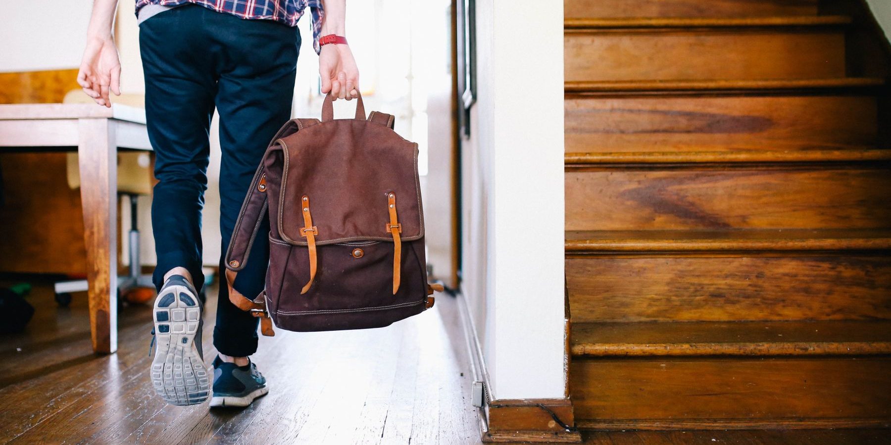 Person with back-pack walking.